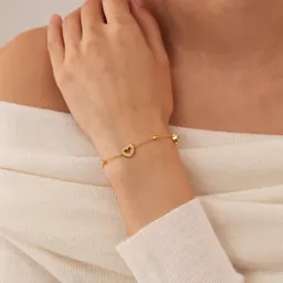 Pulseira simples e nicho europeia e americana para mulheres, da fábrica de jóias OPK, aço inoxidável, banhada a ouro, coração oco, joalharia versátil para mão, por grosso