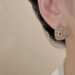 Pendientes de botón versátiles de diseño de nicho, de alta gama y súper de hadas para mujer