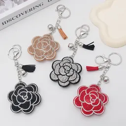 Gränsöverskridande kreativt plommonblomma hett diamanter nyckelring, fashionabel och söt väskfrans bilhängare, grossist i lager