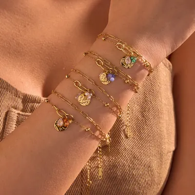 Pulseira de aço titânio com pingente de zircon em forma de gota e pérola