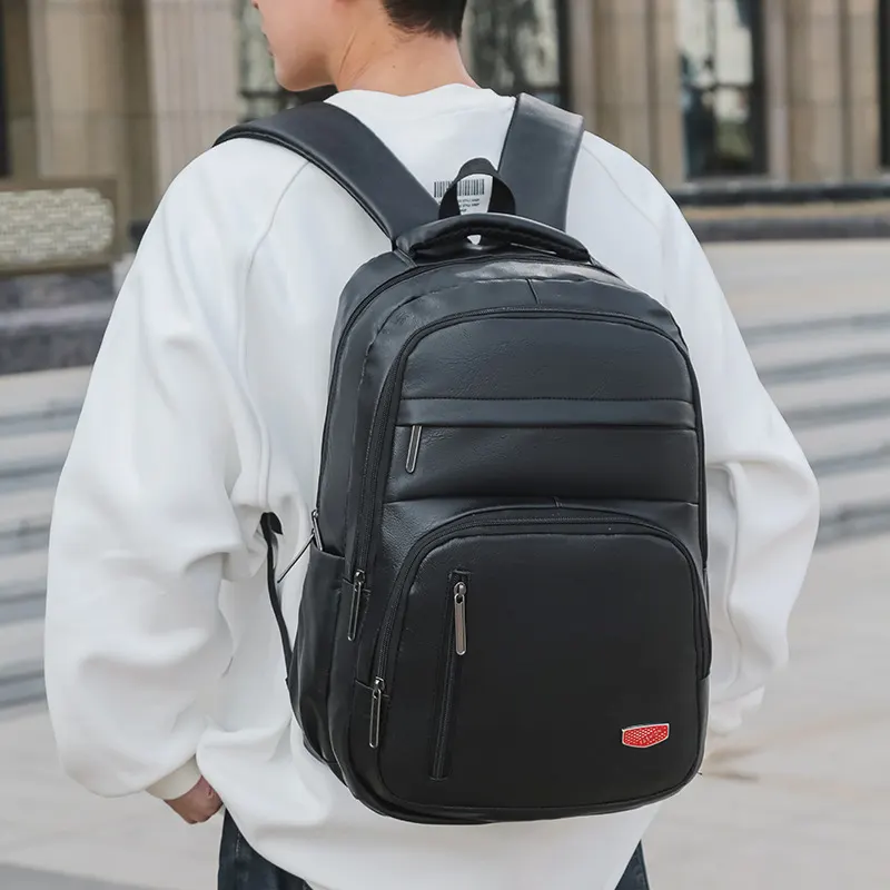 跨境新款PU软皮双肩包大容量男休闲学生书包商务耐磨旅行电脑背包