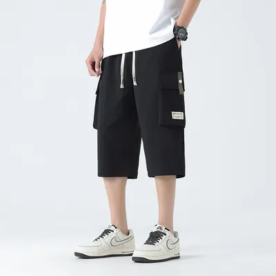 Bermudas de sete quartos para homens, marca de tendência, calças cargo casuais desportivas largas e elegantes para o verão, versáteis, com bolso grande, de perna reta para homens