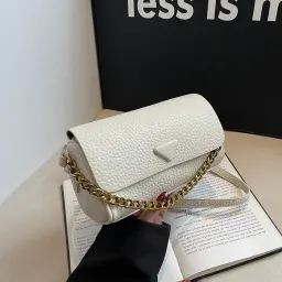 Populär niche-designer rund cylinderväska för kvinnor, ny fashionabel pendlerväska, mjuk läder axel-crossbodyväska