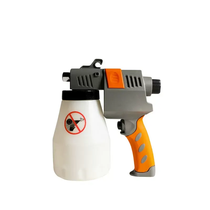 Pistola de limpieza de alta presión para eliminar manchas en prendas de vestir.