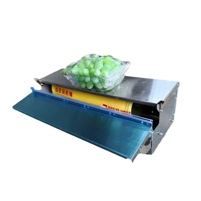 Máquina manual para envolver y empacar alimentos con film transparente. Dispensador de film para frutas y verduras frescas.